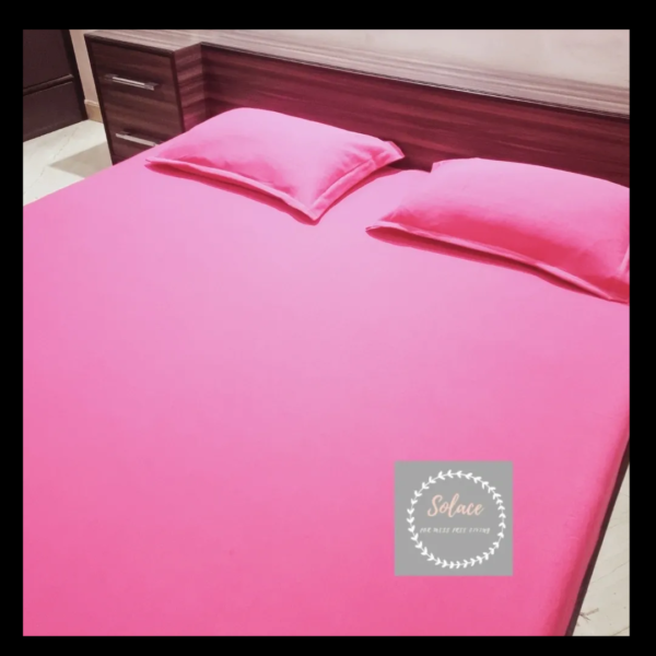 Pink solid hosiery fitted bedsheet with same pillow cover