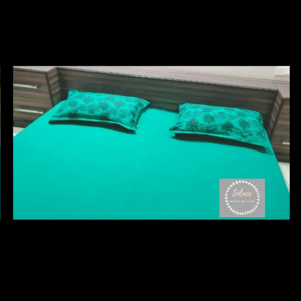 Bottle Green Solid hosiery fitted bedsheet with printed pillow covers