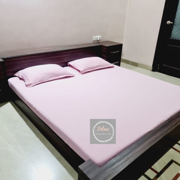 Baby pink solid hosiery fitted bedsheet with same pillow covers