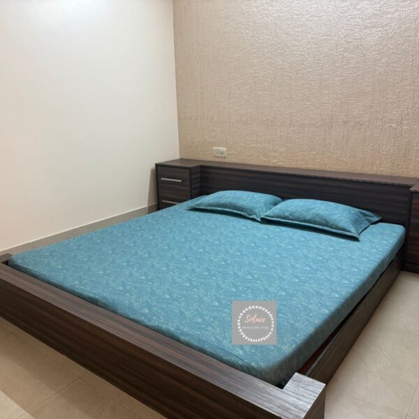 Turquoise colour printed hosiery bedsheet with same pillow covers